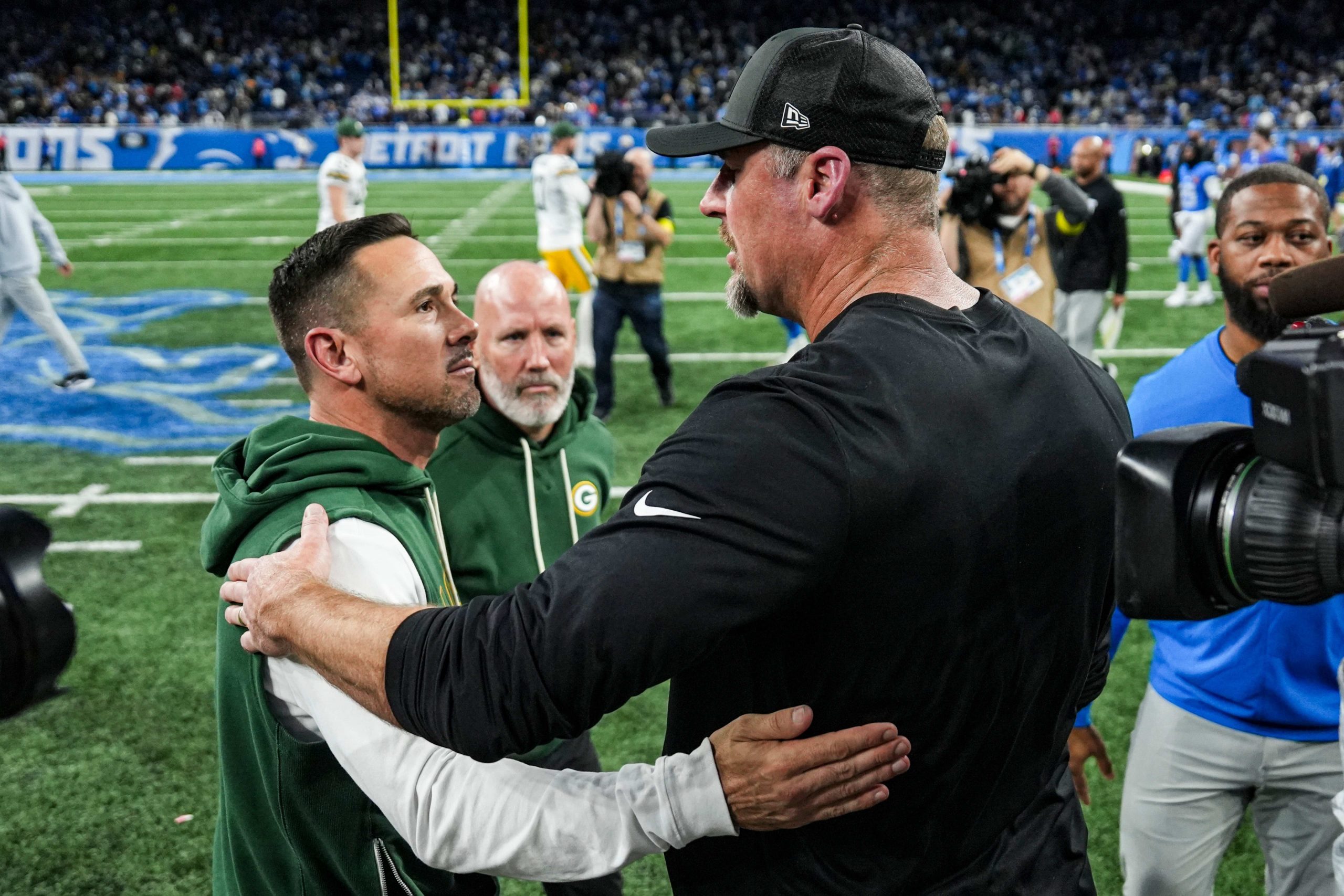 Detroit Lions head coach Dan Campbell, right, shakes hands with Green Bay Packers head coach Matt LaFleur after 31-24 loss at Ford Field in Detroit on Thursday, Nov. 27, 2025.